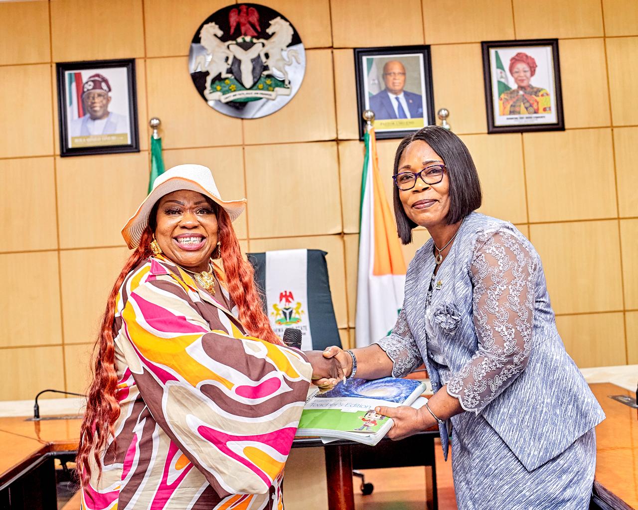 Arit Foundation presenting a new library facilities/resources to the first lady of Akwa Ibom